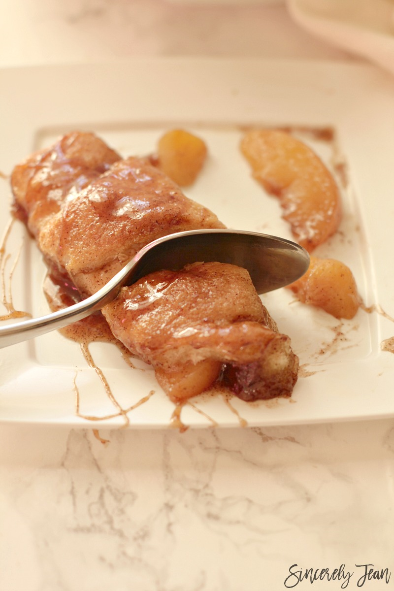 Easy Peach Dumplings - Simple and delicious dessert that combines peaches, crescent rolls, brown sugar, butter, vanilla, and cinnamon! Yum! www.SincerelyJean.com